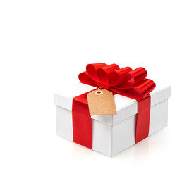 Gift box with red ribbon bow decoration on white background