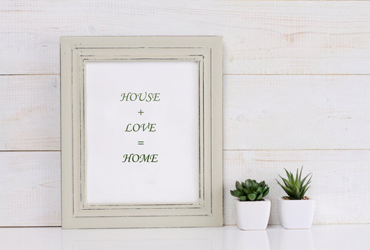 Home, love, family  and happiness concept. Poster in frame shabby chic, vintage style. Scandinavian style home interior decoration.