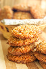 Homemade crispy cereal cookies on rustic wooden board.