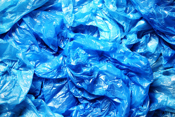 A lot of crumpled blue plastic bags