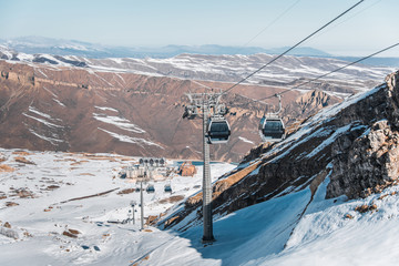 Ski lifts durings bright winter day