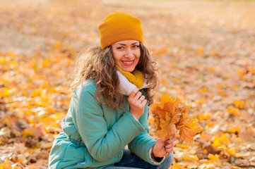 Autumn woman on leafs background