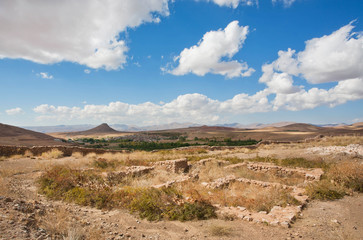 Ruined city in beautiful valley in the Middle East with low mountains