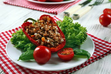 Stuffed peppers with vegetables on table close up