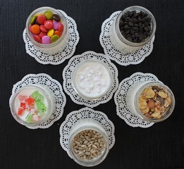 
Natural fresh homemade yogurt from cow's milk handmade with probiotic bacteria, with muesli sunflower seeds, candied fruits, dried fruits, nuts