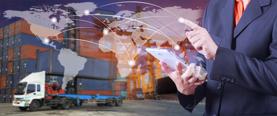 hand presses on world map with digital tablet,Industrial Contain