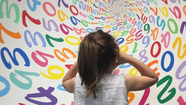 Little girl frustrated with arithmetic problem