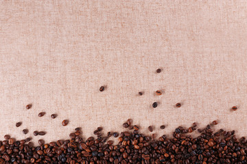 Roasted coffee beans on the linen fabric