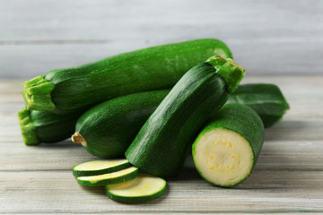 Fresh zucchini on wooden background
