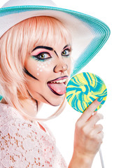 Girl with makeup in the style of pop art, hat and lollipop.