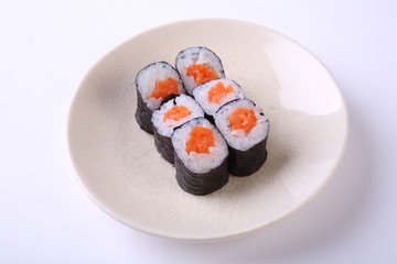 Salmon maki sushi on ceramic dish isolated on white background