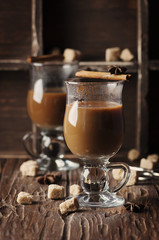 Hot american coffee with cinnamon on the vintage table