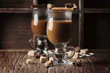 Hot american coffee with cinnamon on the vintage table