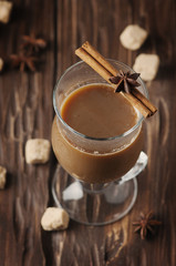 Hot american coffee with cinnamon on the vintage table