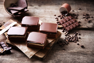 Delicious chocolate brownies on wooden background