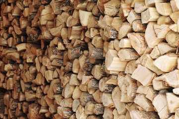 Dry chopped firewood logs in a pile.