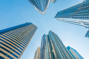 Fototapeta na wymiar Tall Dubai Marina skyscrapers in UAE