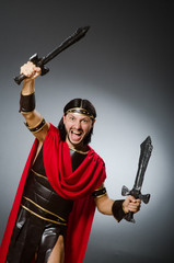 Roman warrior with sword against background