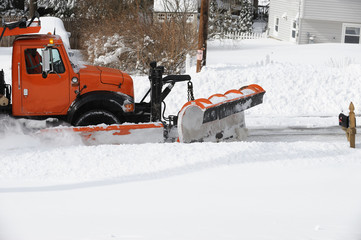 snowplow removing snow in winter