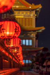 Row of red Chinese Lantern at chinese temple at night.