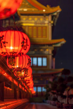 Row Of Red Chinese Lantern At Chinese Temple At Night.