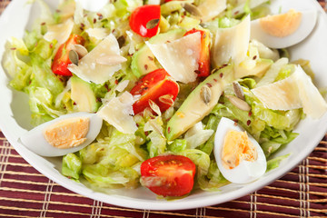Salad with iceberg, cherry tomato and avocado