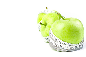 green apple with Measuring tape on white background 