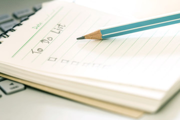 close up wooden pencil on Handwritten to do list plan 