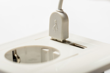 Charging. Somthing charged from the socket, with two usb-charger