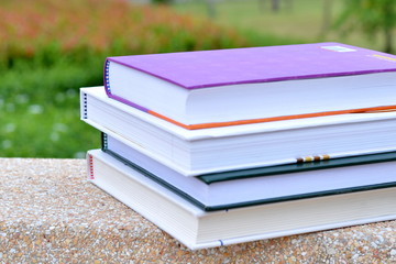 Books in the garden/Stack of books in the garden.