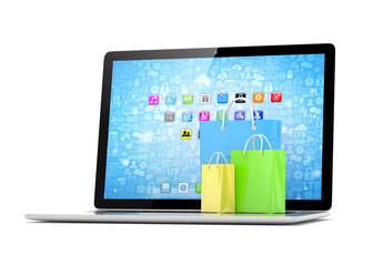 laptop and  shopping pags on white background