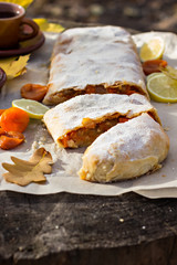 Strudel with custard and orange. Christmas Stollen. Christmas table decoration.
