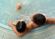 couple in jacuzzi enjoying a hydrotherapy session