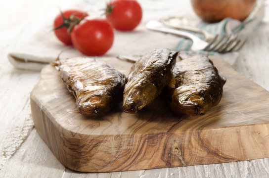 smoked vendace on wooden board