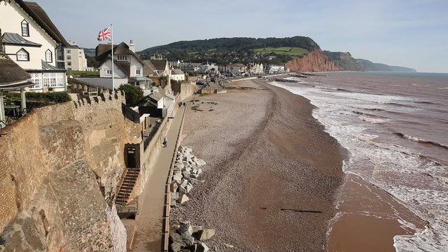 Sidmouth beach seafront and coast Devon England UK view to east