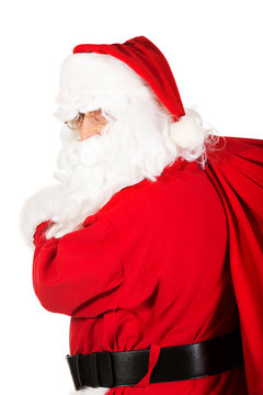Santa Claus carrying bag with presents