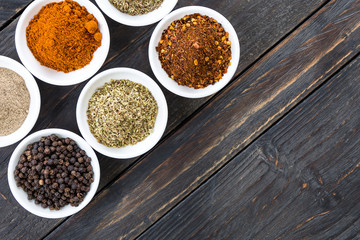 Spices and herbs in  bowls.