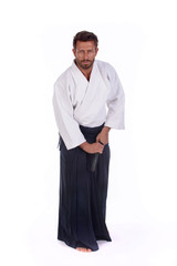 Obraz na płótnie Canvas aikido master ready to draw the sword