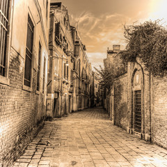 picturesque backstreet in Venice in sepia tone
