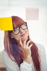 Attractive thoughtful hipster woman posing