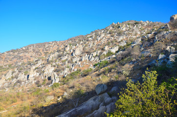 Fototapeta na wymiar Dry mountain with blue sky