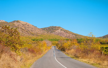 Fototapeta na wymiar Autumn landscape with mountains and mountain roads