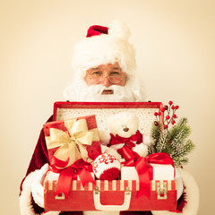 Santa Claus holding suitcase