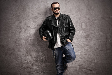 Young male biker smoking a cigarette