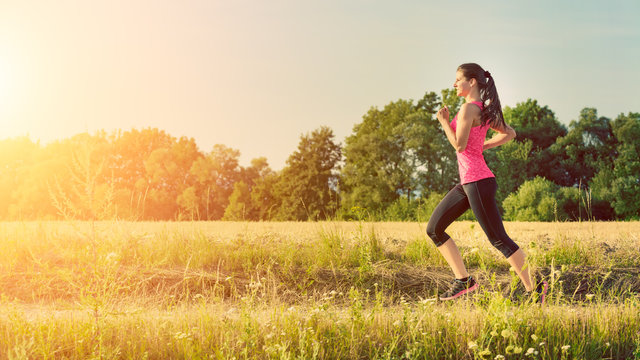 Attractive Young Female Jogging In Countryside