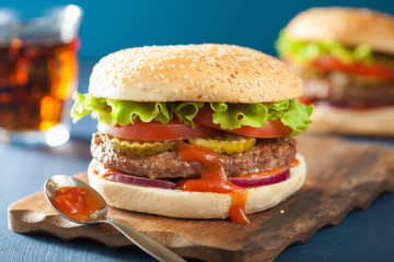 burger with beef patty lettuce onion tomato ketchup