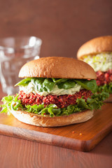 veggie beet and quinoa burger with avocado dressing