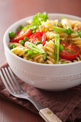 vegetarian pasta fusilli with tomato peas herbs