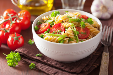 vegetarian pasta fusilli with tomato peas herbs
