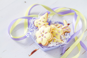 Easter cookies in heart shaped bowl